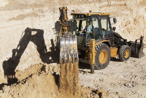 excavator digging in sand
